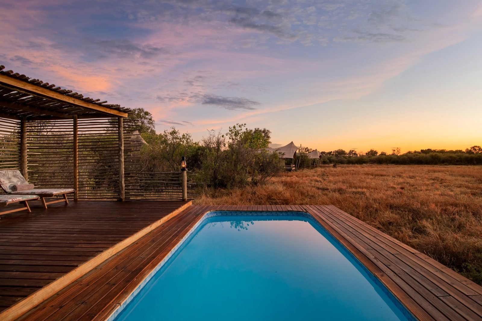 Camp Khwai — pool deck at sunset